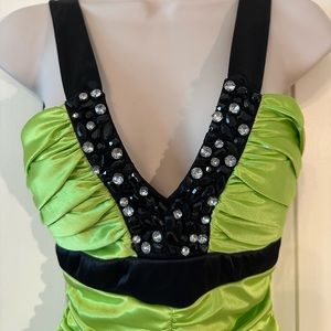 Lime green mermaid style evening gown with beaded accents